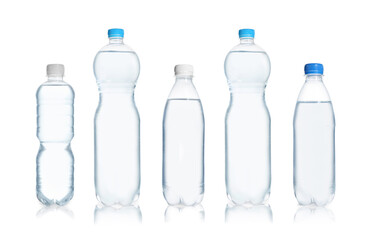 Set with different bottles of pure water on white background