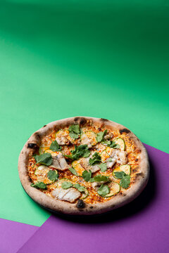 Seafood gourmet pizza with trout fillet and parsley, top view, studio shot with soft light