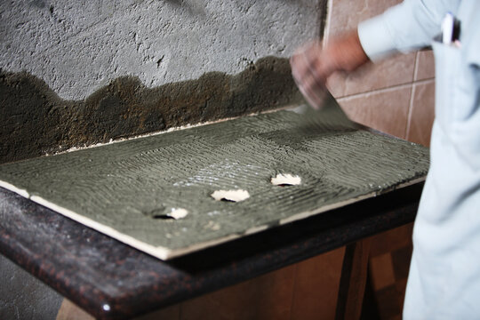 Tile fixing with cement in batroom