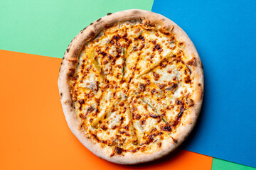 Three cheese pizza on graphical modern background,above view