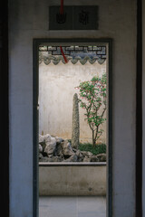 Landscape and buildings in Master of the Nets Garden, a classical Chinese garden in Suzhou, China