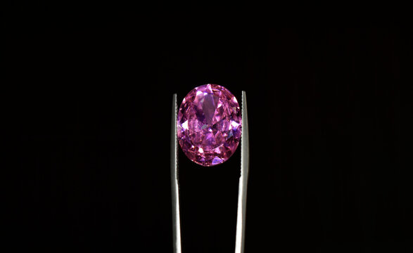 A Beautiful Shiny Pink Gem In The Gemstone Clip