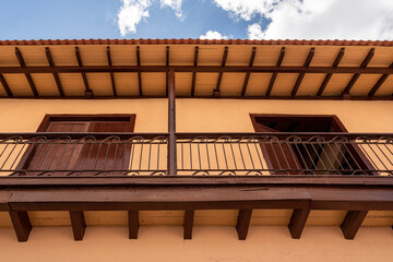 Colonial balcony and porch in a house located in 'Las Enramadas' promenade in Santiago de Cuba, Cuba