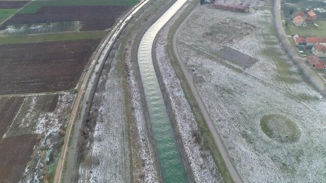 Small river in Pirot Serbia Top down aerial drone view. Small river Nisava.  winter