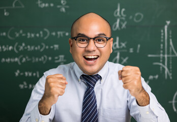 Indian young teacher man looking at camera sitting teaching online video conference live stream....