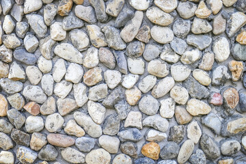 Close up of concrete wall made from pebbles texture background