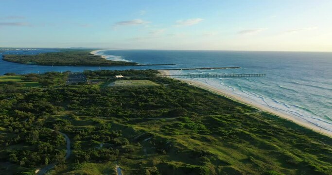 Flying over the Gold Coast spit at sunrise, views of South Stradbroke and golden beaches