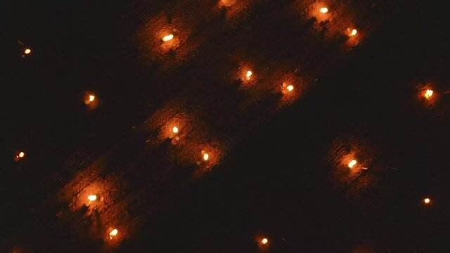 Top down aerial view of the candles burning to heat up the Vineyards in Chablis, France