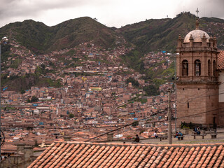 People in Peru looking over the rooftops of Cusco