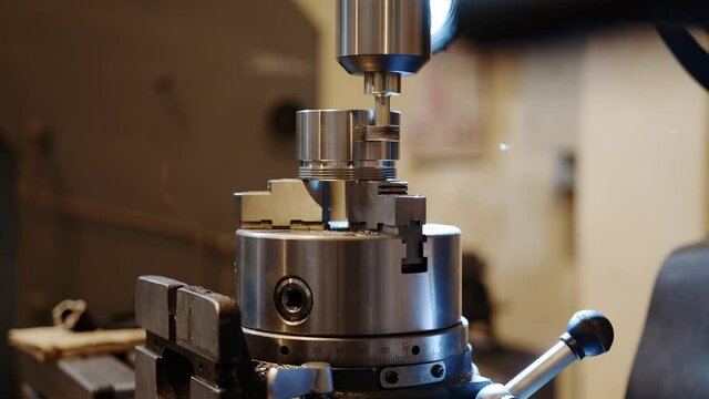 Turning the aluminum parts CNC drill machine. Swarf flies.