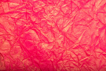 Fototapeta premium Pink crumpled paper texture or background.