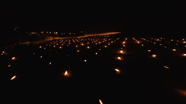 Fast FPV Aerial over the Candles burning to heat up the Vineyards in Chablis, France