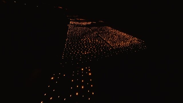 Fast FPV aerial revealing the Candles burning to heat up the Vineyards in Chablis, France