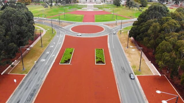 Slow Panning Upwards Revealing Drone Shot, Showing Anzac Parade With The Canberra War Memorial And Mount Ainslie In The Background