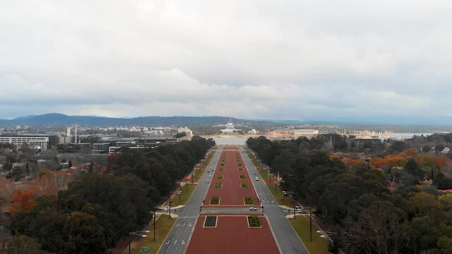 Forward Flying Drone Shot, Showing Anzac Parade With Lake Burley Griffin, The Old Parliament And New Parliament House In The Background. Canberra, Australia
