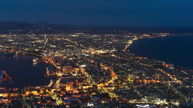 City turning to dark. Hakodate in Hokkaido, Japan panoramic timelapse view