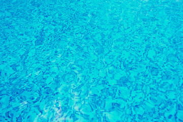 Abstract pool water.  Swimming pool flow with waves background surface of blue swimming pool