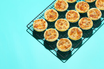 Mini pie from meat and mushrooms in metal tray