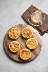 Mini pie from meat and mushrooms in wooden tray
