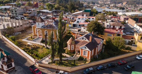 Old houses and streets of the magical town of "El Oro" State of Mexico, the characteristic roofs of these houses match the forest