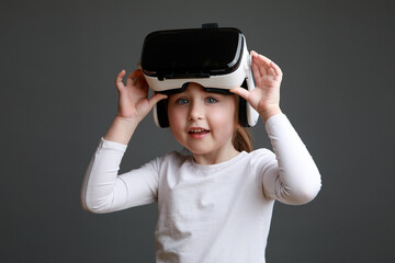 Little girl with virtual reality headset. Innovative technology and education concept
