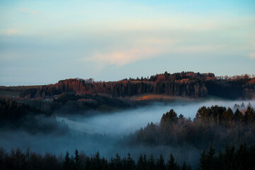 Foggy autumn landscape in the bavarian forest