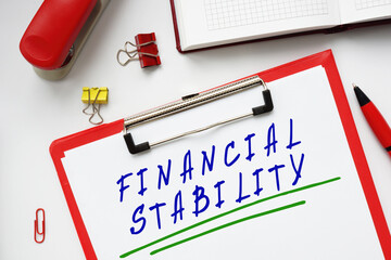 Financial concept about FINANCIAL STABILITY with sign on the page.