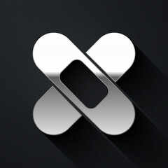 Silver Crossed bandage plaster icon isolated on black background. Medical plaster, adhesive bandage, flexible fabric bandage. Long shadow style. Vector