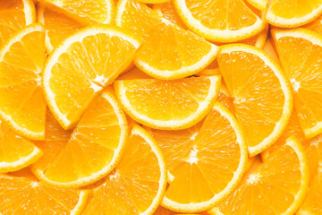Fototapeta na wymiar Pieces of fresh oranges as background