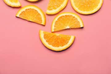 Slices of fresh oranges on color background