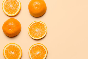 Pieces of fresh oranges on color background