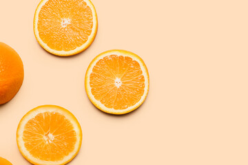 Pieces of fresh oranges on color background