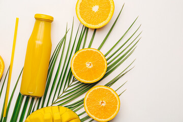 Bottle of fresh tropical juice with fruits on white background