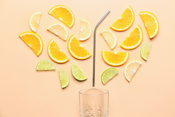 Cut citrus fruits with glass and cocktail straw on color background