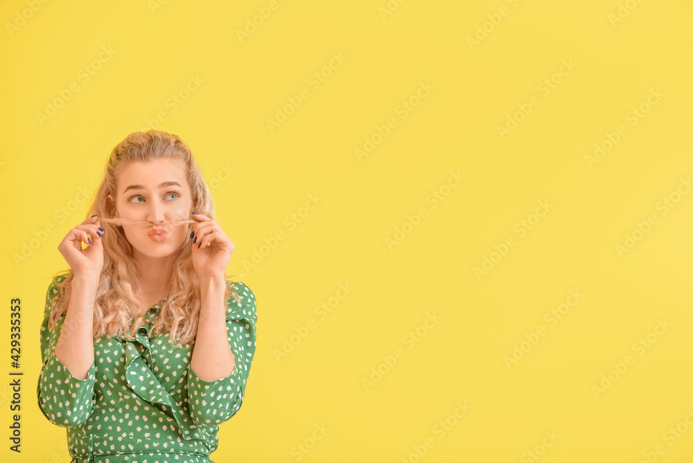 Sticker fashionable young woman on color background