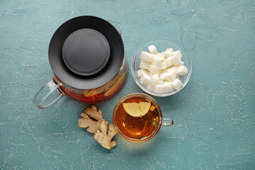Composition with tasty ginger tea and ingredients on color background