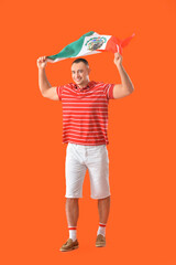 Young man with Mexican flag on color background