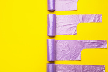 Naklejka premium Rolls of garbage bags on color background