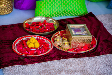 Fototapeta na wymiar Indian Punjabi pre wedding Choora ceremony, ritual items, bangles and decorations close up