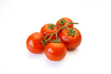 Red tomatoes on a branch on a white background.