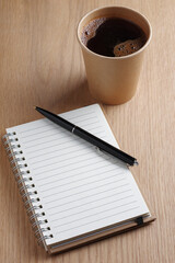 Notebook, pen and coffee