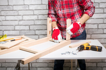 Professional Furniture Assembly Worker Assembles Chair. Furniture Installation.