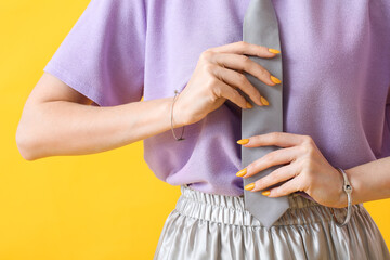 Young woman with beautiful manicure on color background