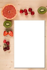 Spring fruit background with blank white paper for text Food mock up empty card paper invitation recipe space for text sign