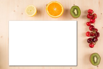 Top view and mockup white blank paper Spring fruits on wooden background Mock up grapefruit kiwi cherry strawberry fruit on table wood
