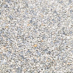 Abstract grey dry small stones background little pebbles