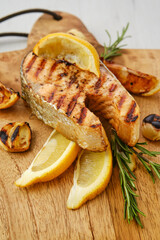 Close up view of raw trout steaks on wooden cutting board
