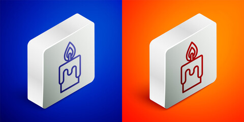Isometric line Burning candle icon isolated on blue and orange background. Cylindrical candle stick with burning flame. Silver square button. Vector