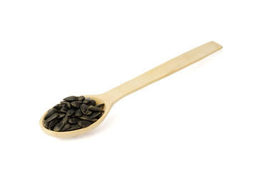 sunflower seeds in wooden spoon isolated on white background,