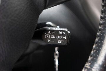 Generic car cruise control tempomat lever macro close up shot
